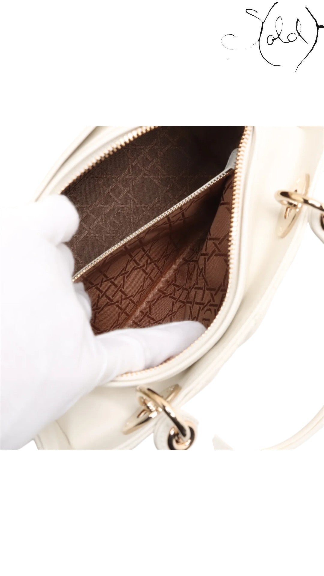 Sold Attire white lambskin Lady Dior medium bag with rose gold hardware and signature cannage quilting. Interior features brown Dior logo lining.