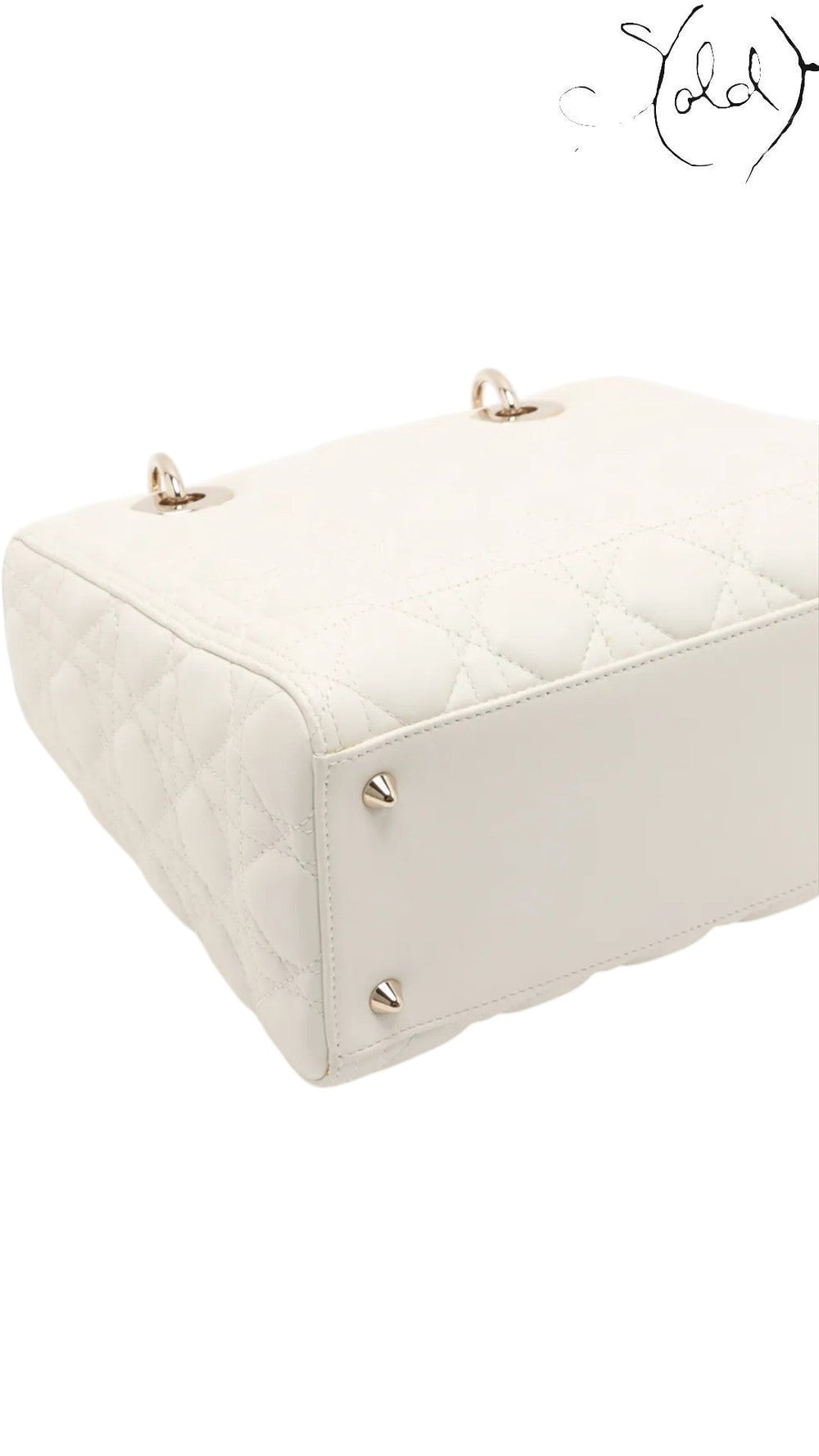 Sold Attire: White lambskin Dior Lady Dior medium bag with rose gold hardware and cannage quilting.