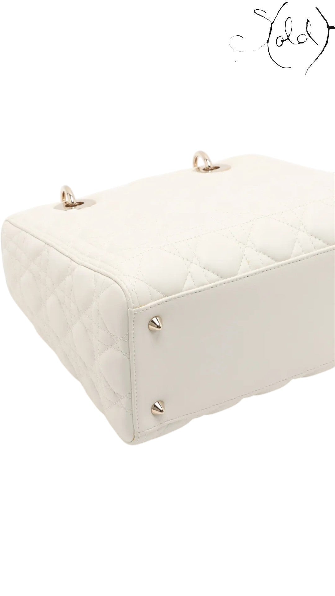 Sold Attire: White lambskin Dior Lady Dior medium bag with rose gold hardware and cannage quilting.