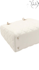 Sold Attire: White lambskin Dior Lady Dior medium bag with rose gold hardware and cannage quilting.