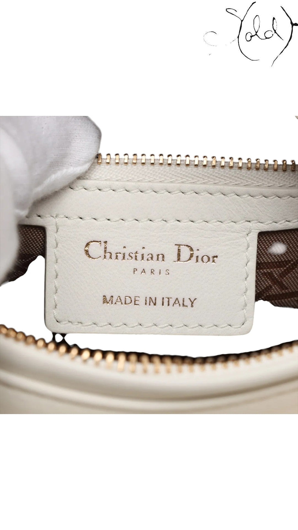 Sold Attire white lambskin Lady Dior medium bag with rose gold hardware and cannage stitching.