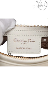 Sold Attire white lambskin Lady Dior medium bag with rose gold hardware and cannage stitching.