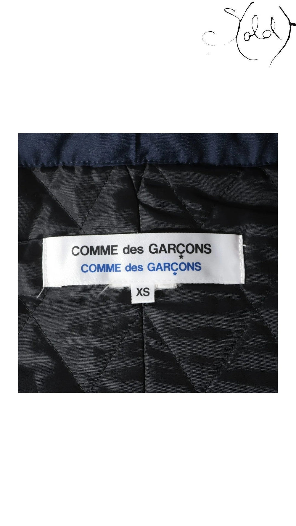Sold Attire navy polyester padded cape coat from Comme des Garçons AW16 collection, size XS. Features quilted lining and signature branding.
