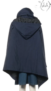 Sold Attire navy polyester padded cape coat with hood, AW16 collection. Features a quilted lining and architectural silhouette.