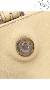 Sold Attire beige calf leather Dior Gaucho shoulder bag detail showing the silver-tone magnetic hardware closure