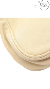 Close-up of the beige calf leather texture and curved flap edge of a vintage Sold Attire Dior Gaucho shoulder bag