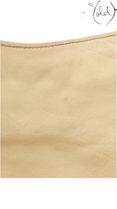 Sold Attire beige calf leather texture detail of a vintage Dior Gaucho shoulder bag showing fine grain and stitching