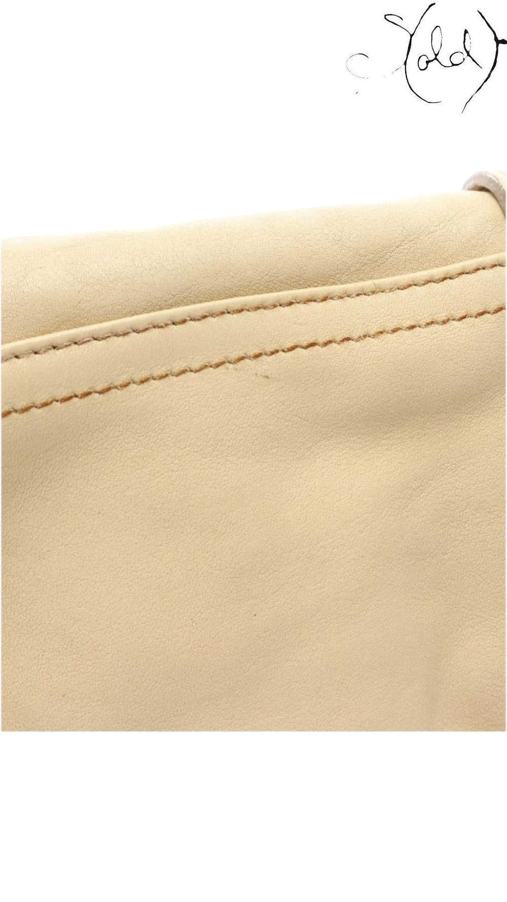 Sold Attire beige calf leather texture detail of a vintage Dior Gaucho shoulder bag with visible contrast stitching