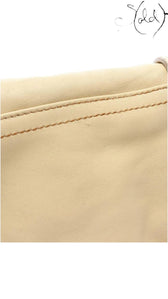 Sold Attire beige calf leather texture detail of a vintage Dior Gaucho shoulder bag with visible contrast stitching