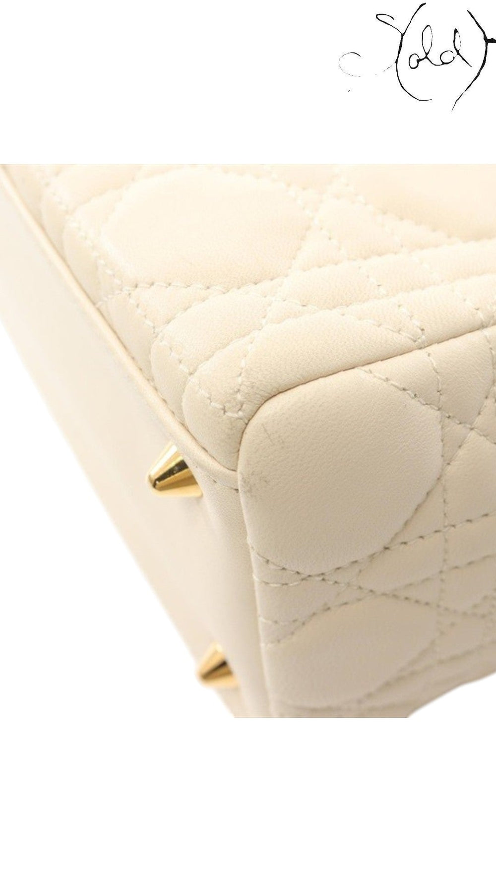 Sold Attire ivory Dior Lady Dior handbag featuring signature Cannage quilted leather and gold-tone protective feet.