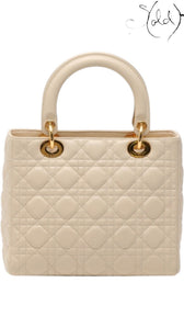 Sold Attire ivory Dior Lady Dior handbag in quilted Cannage leather with gold-tone hardware and top handles.