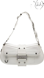 Sold Attire vintage Dior Street Chic shoulder bag in white leather with silver-tone hardware and front flap closure.