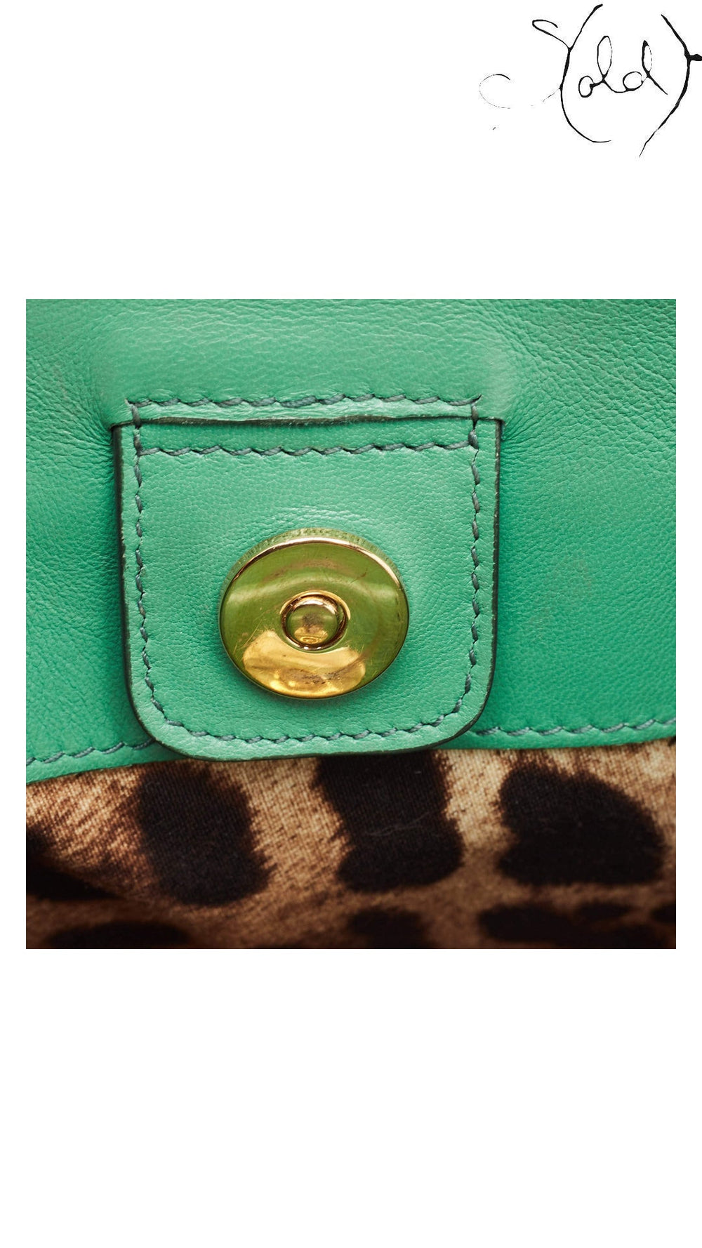 Interior magnetic closure tab on Dolce & Gabbana green python Miss Sicily tote
