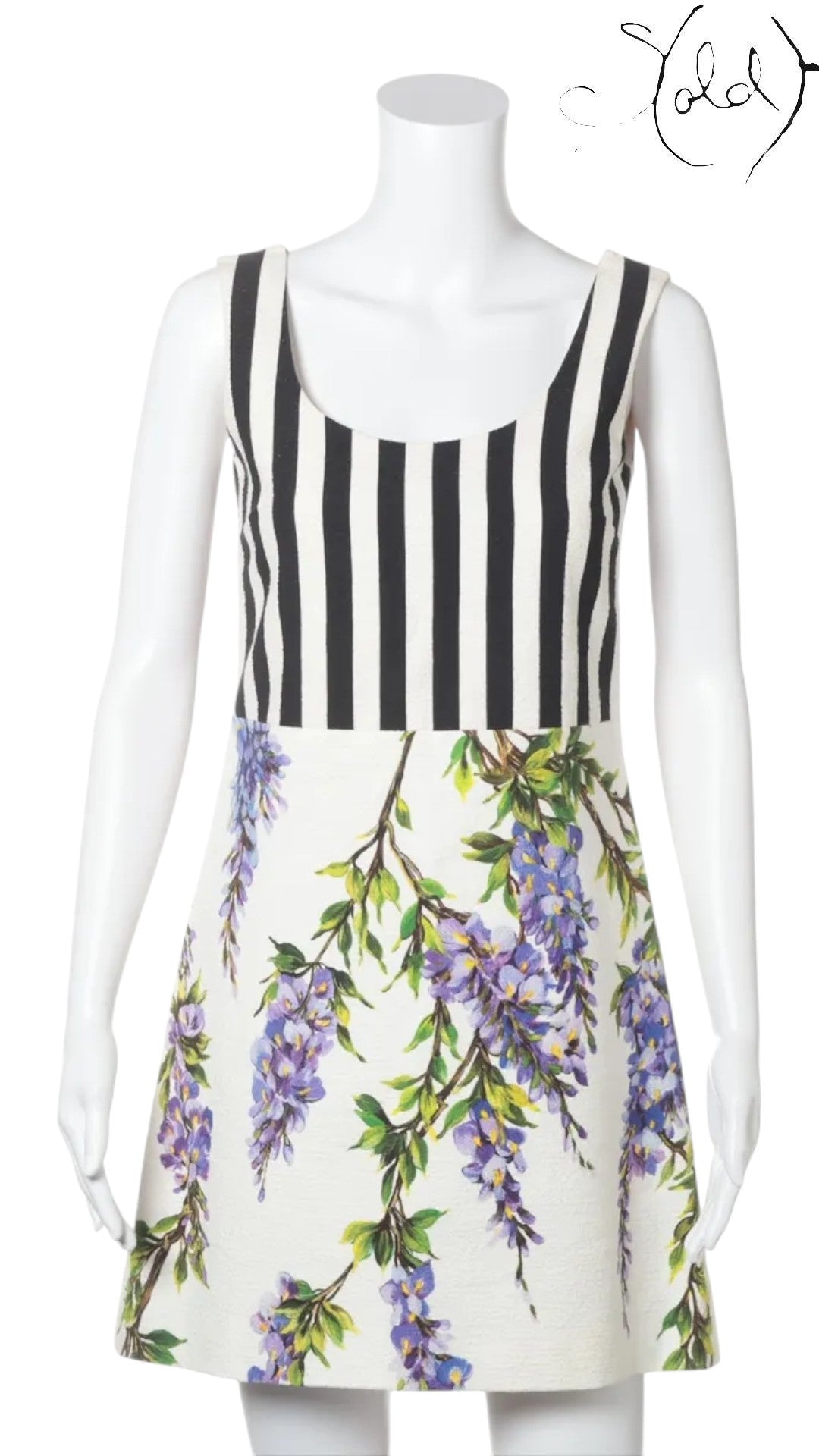 Sold Attire: Dolce & Gabbana sleeveless white dress with purple wisteria print and black and white striped bodice.
