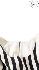 Sold Attire Dolce & Gabbana sleeveless dress with black and white stripes and wisteria print. Cotton-polyurethane blend.
