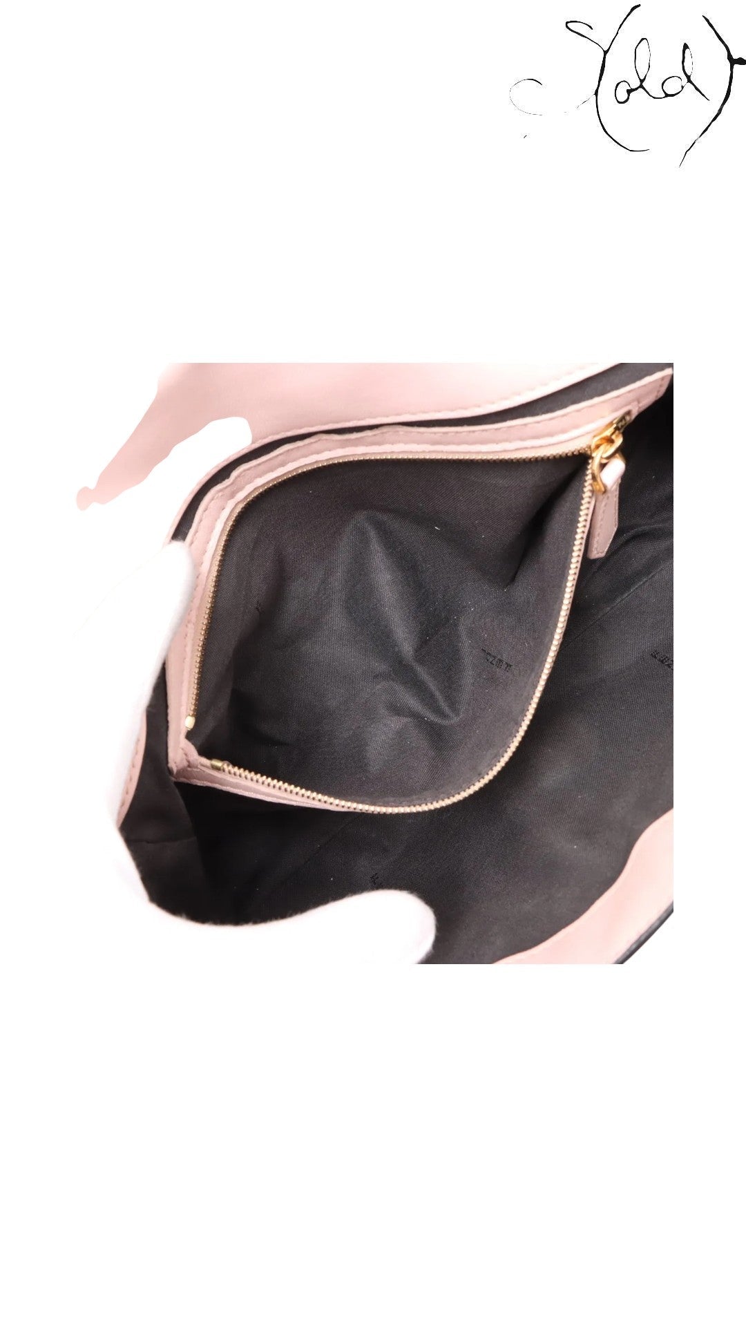 Sold Attire pink embossed calfskin Fendi Mamma Baguette interior with FF jacquard lining and gold-tone zipper.