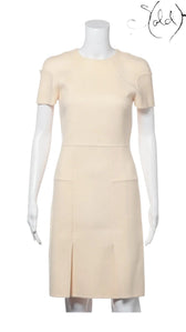 Sold Attire Fendi ivory wool sleeveless dress with a structured silhouette and subtle pocket details. Size 38.