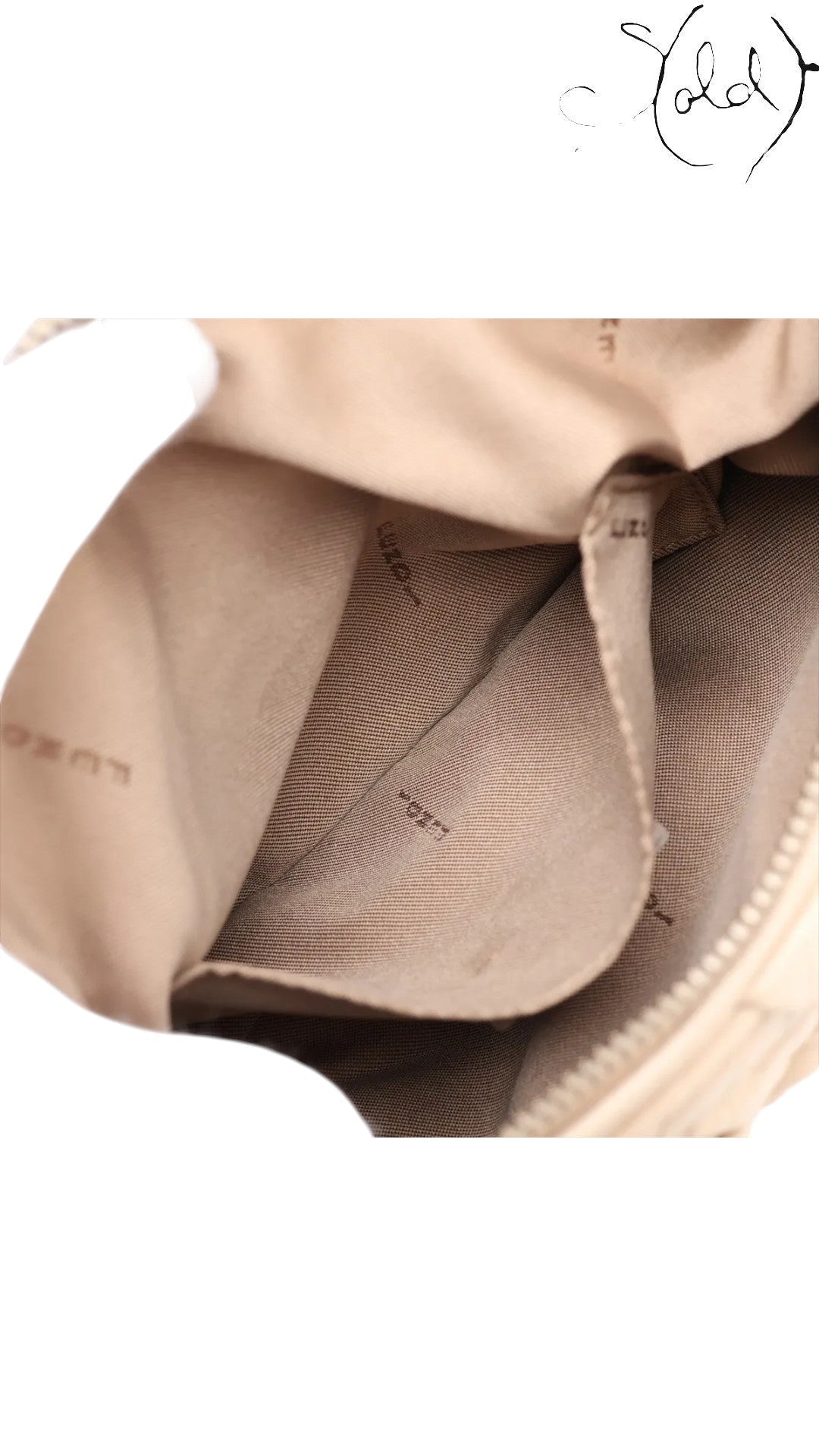 Sold Attire beige leather Fendi Knot shoulder bag with jacquard lining and gold-tone zipper.