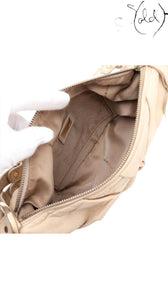 Sold Attire beige leather Fendi Knot shoulder bag with gold-tone hardware and jacquard lining.