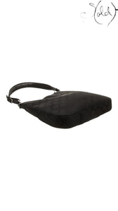Sold Attire pre-owned Gucci hobo baguette bag in black iridescent GG monogram canvas with silver-tone hardware.