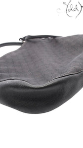 Sold Attire Gucci 00s shoulder bag in black GG Supreme canvas with textured calfskin leather trim and silver hardware.
