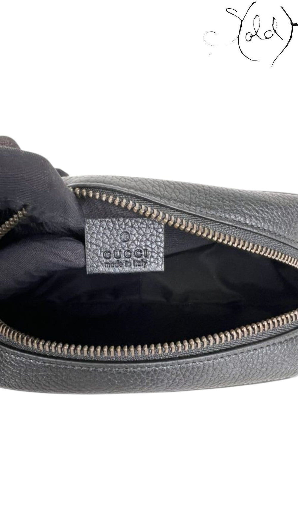 Sold Attire black pebbled calfskin Gucci Soho Disco crossbody bag with embossed GG logo and zip closure.