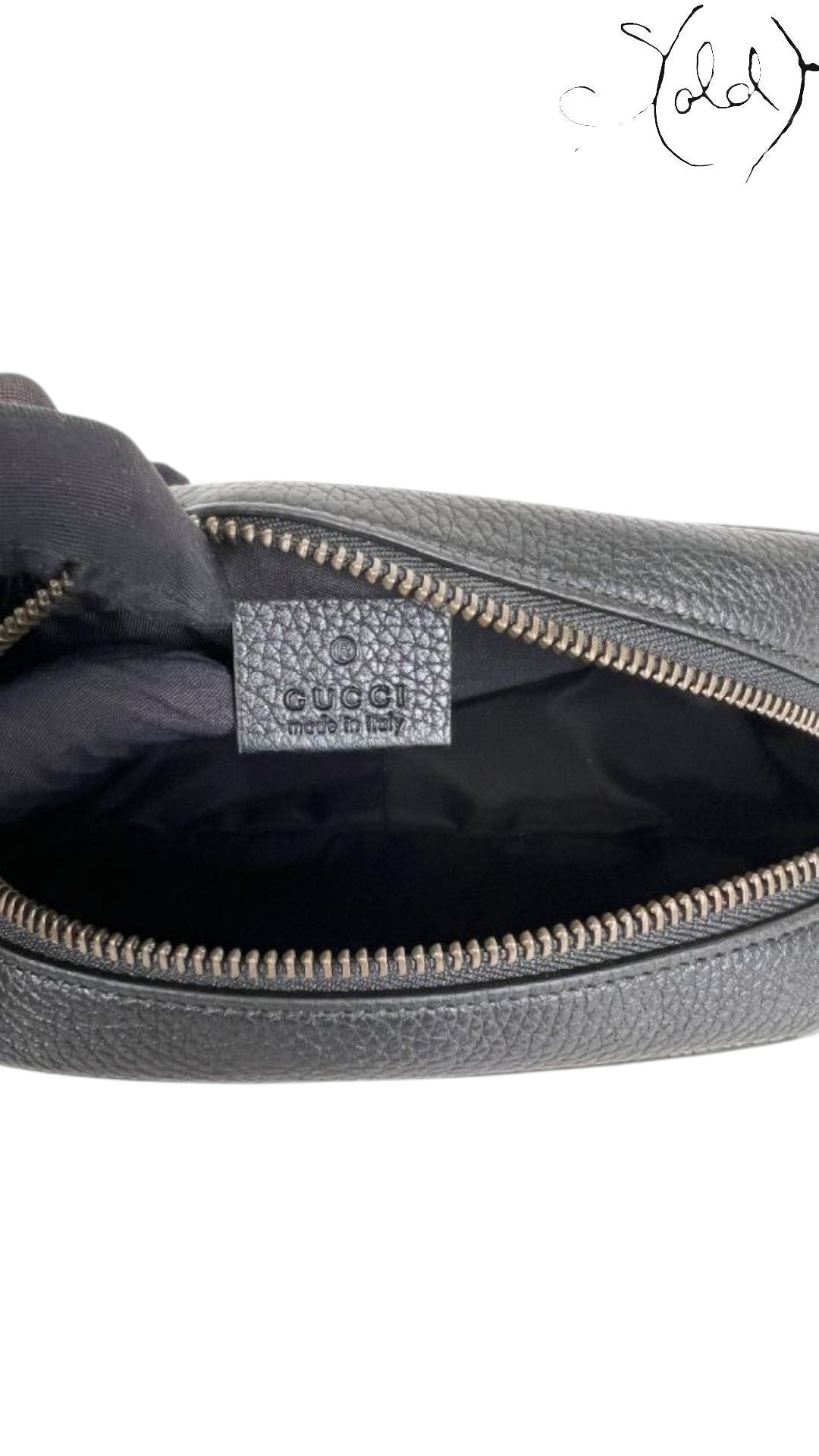 Sold Attire black pebbled calfskin Gucci Soho Disco crossbody bag with embossed GG logo and zip closure.