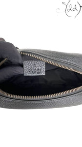 Sold Attire black pebbled calfskin Gucci Soho Disco crossbody bag with embossed GG logo and zip closure.