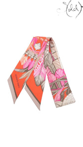 Sold Attire pre-owned Hermes Twilly Danse Pacifique silk ribbon scarf in vibrant pink and orange feather print.