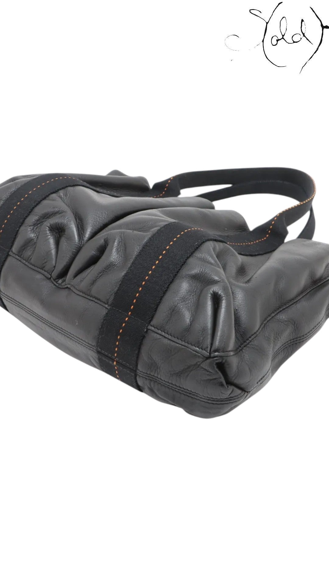 Sold Attire black Veau Derma leather Hermès Caravan Horizontal MM bag with silver hardware and contrast stitching.