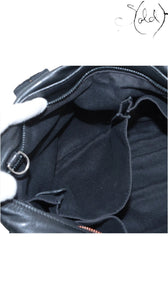 Sold Attire black Veau Derma calfskin Hermès Caravan Horizontal MM handbag interior with multiple compartments and silver hardware.