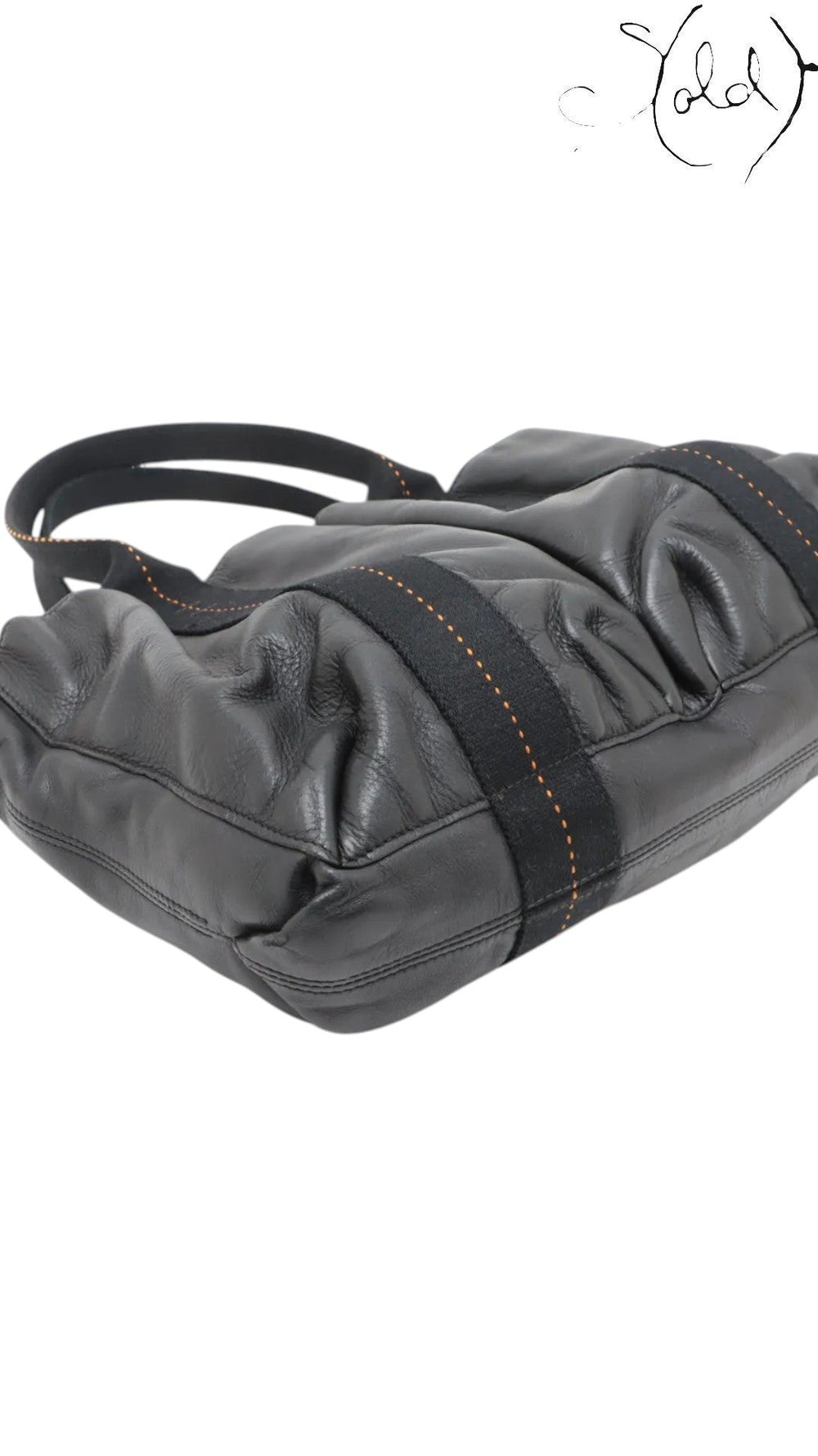 Sold Attire black Veau Derma leather Hermès Caravan Horizontal MM tote with silver hardware and orange contrast stitching.