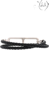Sold Attire: Hermès Roulis Double Tour bracelet in black swift calfskin with palladium hardware. Wraps twice around the wrist.