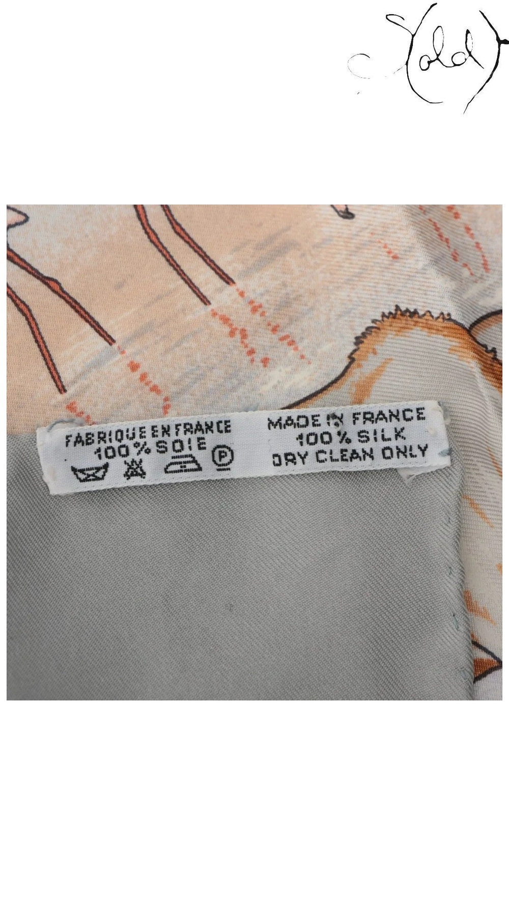 Sold Attire Hermes silk scarf care label showing Made in France and 100% silk composition details.