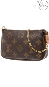 Sold Attire Louis Vuitton Monogram Mini Pochette Accessoires in brown coated canvas with brass chain-link handle.