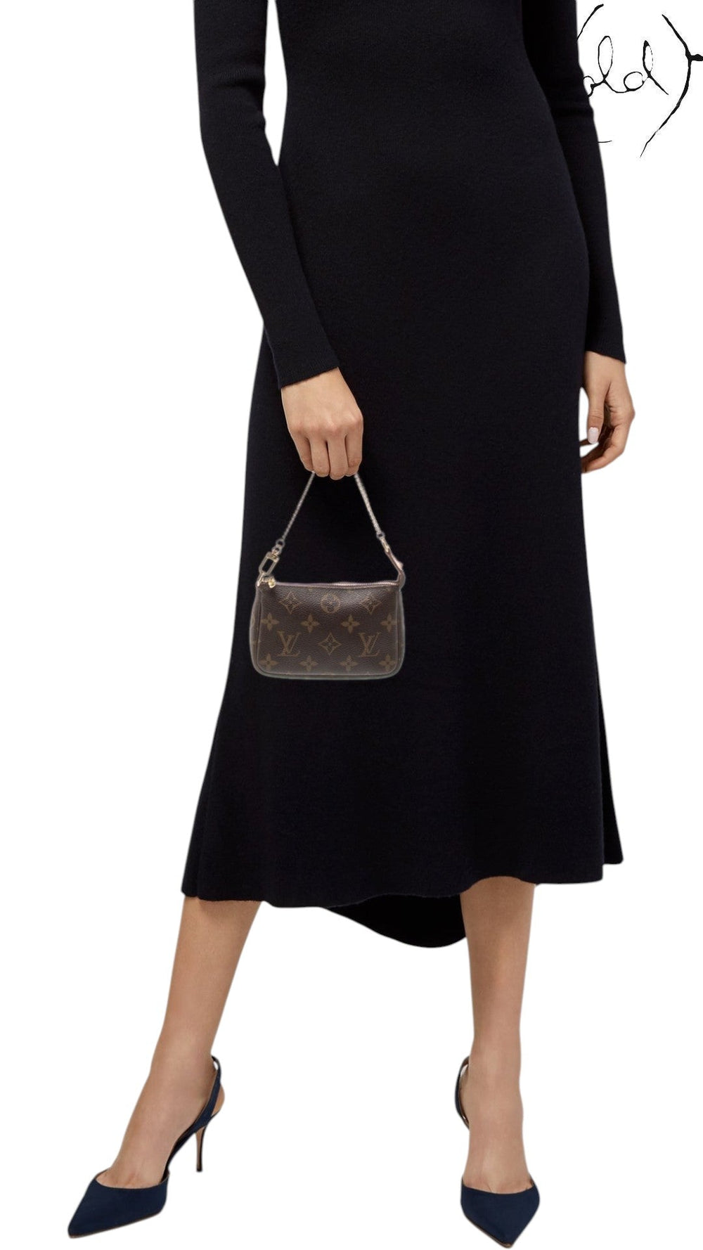 Sold Attire model holding a brown Louis Vuitton Monogram Mini Pochette Accessoires with brass chain handle and zip top.