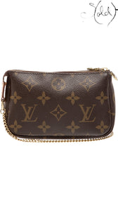 Sold Attire Louis Vuitton Monogram Mini Pochette Accessoires in brown coated canvas with brass chain handle.