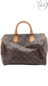 Sold Attire vintage Louis Vuitton Speedy 30 in brown Monogram coated canvas with honey patina vachetta leather handles.
