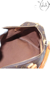 Sold Attire vintage Louis Vuitton Speedy 30 interior view showing clean brown textile lining and monogram canvas