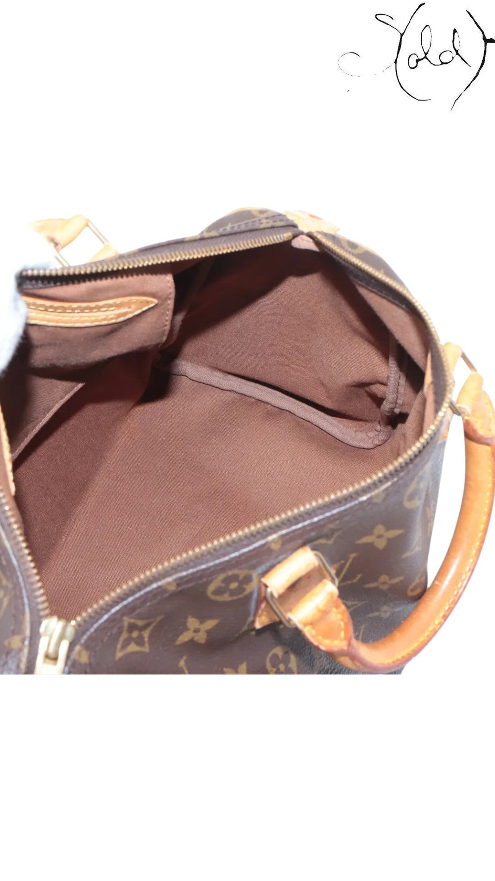 Interior view of a vintage Sold Attire Louis Vuitton Speedy 30 bag showing the clean brown textile lining