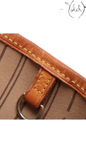 Sold Attire brown Louis Vuitton Monogram Neverfull MM coated canvas tote with vachetta leather trim and gold-tone hardware.