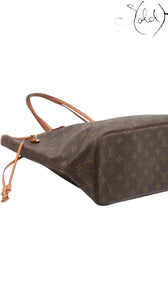 Sold Attire brown Louis Vuitton Monogram Neverfull MM tote bag with vachetta leather trim and gold-tone hardware.