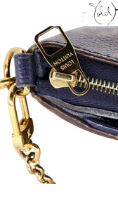 Sold Attire Louis Vuitton Pallas Clutch featuring gold-tone chain hardware, zipper pull, and Blue Marine leather trim.