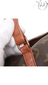 Sold Attire brown Louis Vuitton Monogram Papillon 30 with pouch, featuring vachetta leather trim and brass hardware.