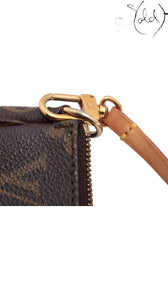 Sold Attire pre-owned Louis Vuitton Pochette Accessoires featuring iconic brown Monogram canvas and gold-tone hardware.