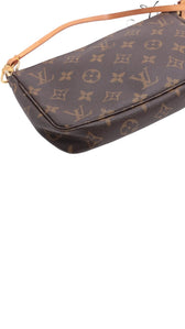 Sold Attire pre-owned Louis Vuitton Pochette Accessoires in brown Monogram coated canvas with vachetta leather strap.