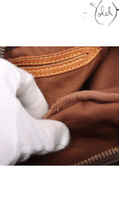 Sold Attire Louis Vuitton Monogram Speedy 25 brown coated canvas interior with leather trim and brass zipper.