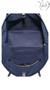 Sold Attire interior view of a navy Louis Vuitton Neverfull MM tote with striped textile lining and gold-tone hardware.