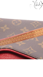Sold Attire pre-owned Louis Vuitton Pallas Clutch in brown Monogram canvas with red leather trim and gold hardware.