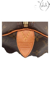 Sold Attire Louis Vuitton Speedy 30 Monogram canvas bag with Vachetta leather trim and brass-tone zipper. Made in France.